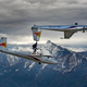 Image for article titled Amazing video of a man holding a glider while flying on another glider